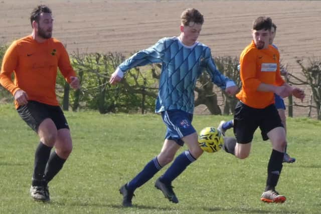 Action from the HKL TWO game between Pilsley Community (tangerine) and Hepthorne Lane. Photo: Martin Roberts.
