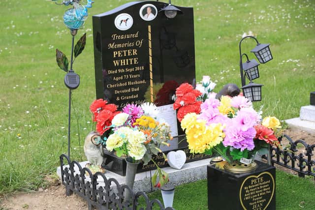 Jean White has placed items such as decorative pots, artificial grass and flowers at her late husband's grave in Eckington Cemetery