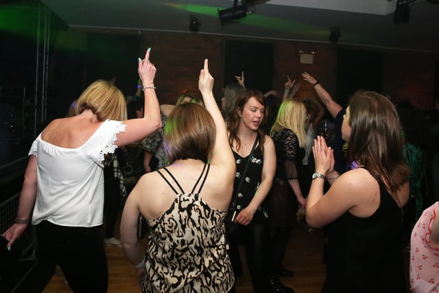 Throwing some shapes on the dancefloor.