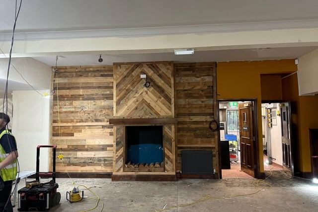 Will this wood-effect decor on the chimney breast and walls either side be part of the pub's new look?