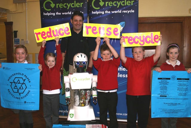 A rapping robot visited eight schools in Derbyshire to educate pupils about recycling. Do you recognise any of the children on the photo and what school were they at?