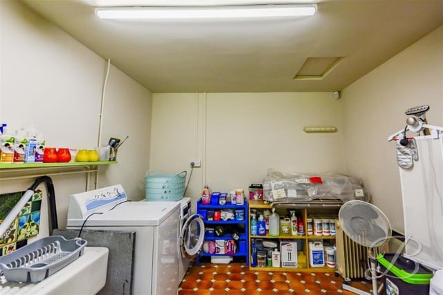 The external outbuildings at the Crow Hill Drive property include this laundry room.