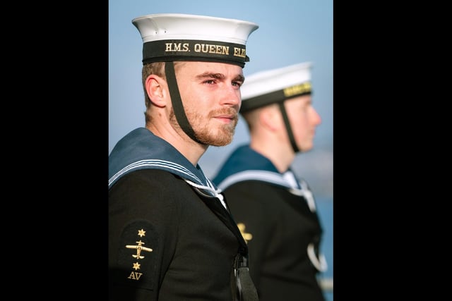 Royal Navy sailor, LAET Phillip Hulbert, searches the crowd for his family as HMS Queen Elizabeth returns to Portsmouth from deployment to the USA. This image was part of the winning selection by Photographer of the Year Leading Photographer Kyle Heller.