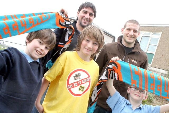 Connor Hallwood, 10, Connor Hicken 10, and Reece Hallwood, 7, of Hady Primary School show their support for Sheffield Steelers during a visit to  their school by team members Ryan Finnerty and Jonathon Phillips.
