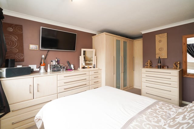 Fitted furniture is a feature of the main bedroom.