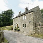 The stone built farmhouse sits in a quiet, rural location on Slack Lane, Ashover.