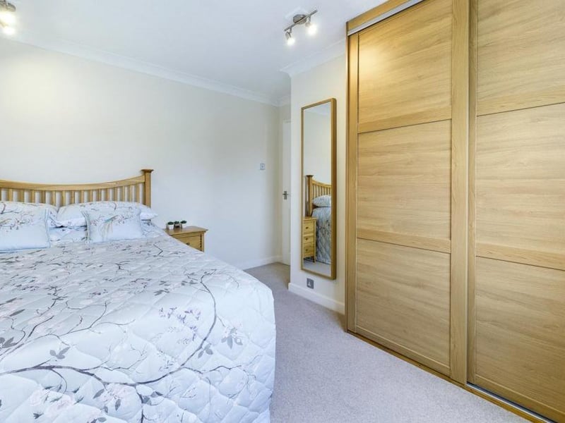 Bedroom 2 - uPVC double glazed window to the rear elevation, fitted wardrobe, ceiling coving, radiator panel and power points.
