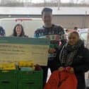 Fortem's team of elves presents cheque to Chesterfield Foodbank