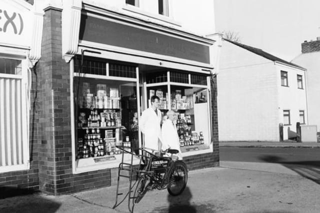 Outside shop, on the corner of Chatsworth Road and Heaton Street, are Brian English and shop assistant Andrew Kay