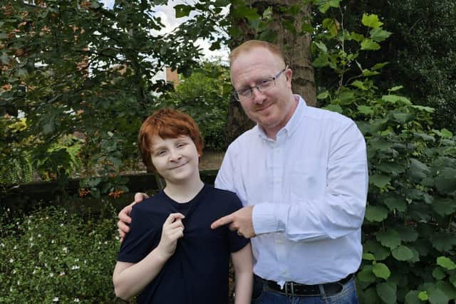 Max (left) and his dad Matt Palfrey with the Fidget-t.
