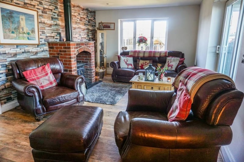 Spacious living room with feature multi fuel log burner,