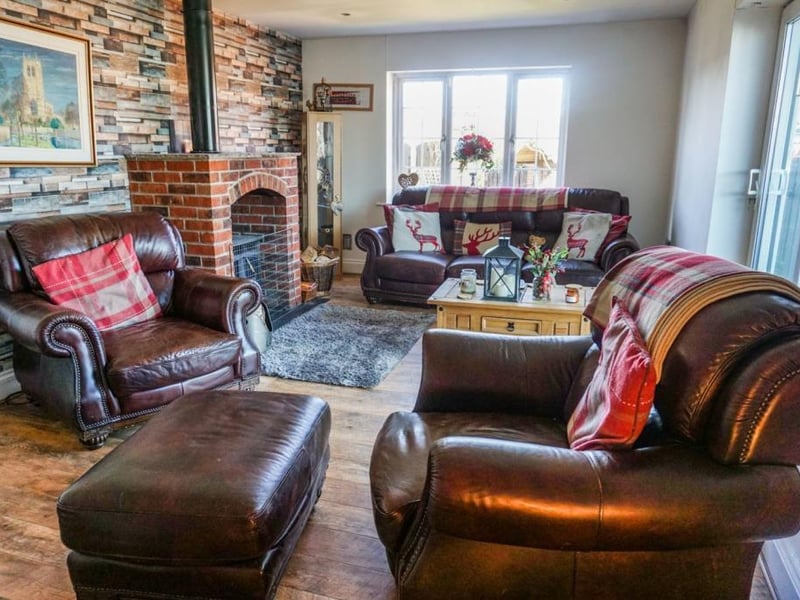 Spacious living room with feature multi fuel log burner,