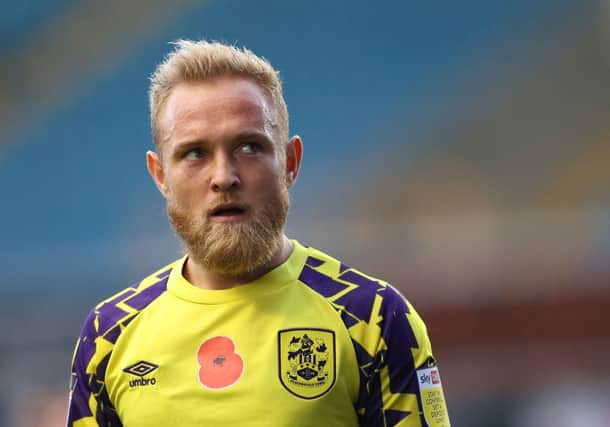 Alex Pritchard playing for Huddersfield Town.