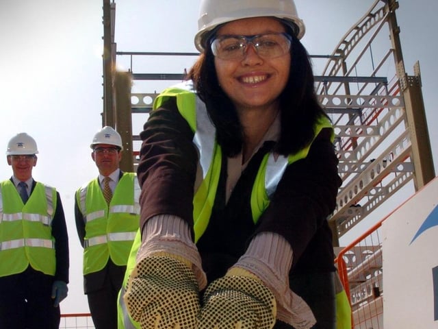 Caroline Flint MP for Don Valley, tightened the ceremonial base-plate nut to a turnminal column at the event marking the official commencement of construction to the new Robin Hood airport Doncaster Sheffield watched by left Robert Hough, chairman Peel airports ltd; and David Glover Construction director Peel Holdings PLC See Story Picture Chris Lawton. April 26, 2004