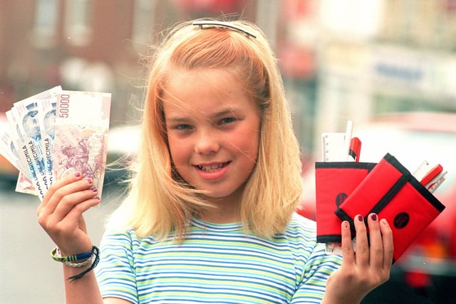 Charlotte Wilde,11, from Totley Primary School, pictured outside Totley Rise Post Office after receiving £50 in Italian lira for her trip to the Children's International Summer Village in Italy in 1998