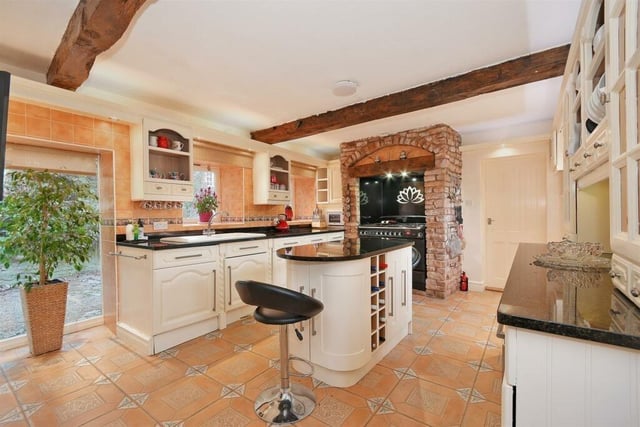 One of the breakfast kitchen's biggest assets is a new Rangemaster oven. Note also the ceiling beams, which add to the character of the property.