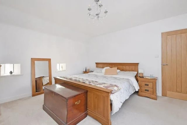 This double bedroom is light and airy, with contemporary decor and good storage options.