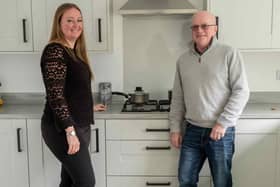 Carla and Tim Goodwin in the kitchen of their new Bellway home at Holbrook Park