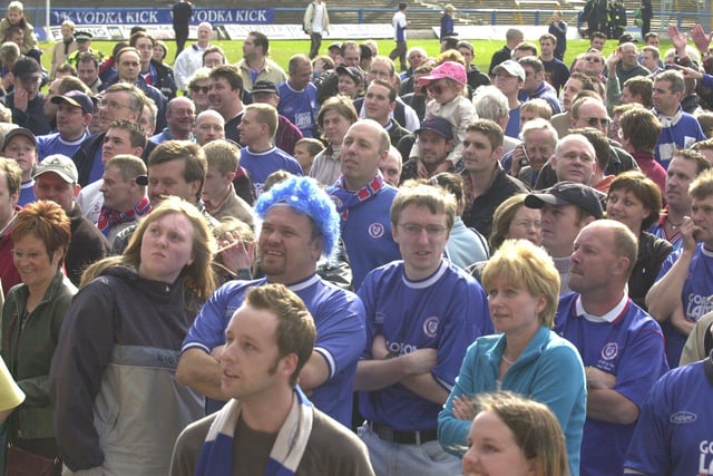 Chesterfield's fans wait for their team to appear in the Directors box after beating Halifax Town in 2001 to secure promotion.