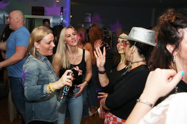 Could these revellers be discussing their favourite '90s tunes?