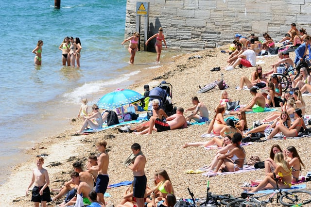 People flocked to the beach at the Hot Walls on the hottest day of the year so far. Picture: Sarah Standing (250620-4929)