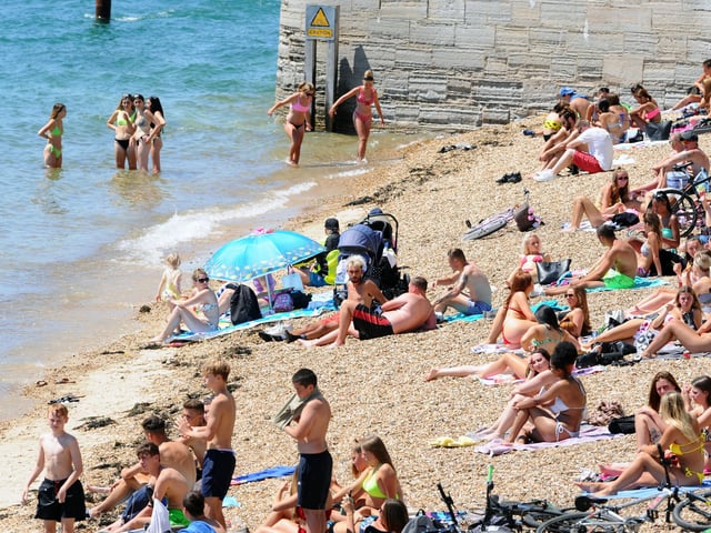 People flocked to the beach at the Hot Walls on the hottest day of the year so far. Picture: Sarah Standing (250620-4929)