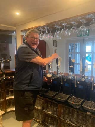 Garry Norton behind the bar at The Neptune Beer Emporium, Chesterfield.