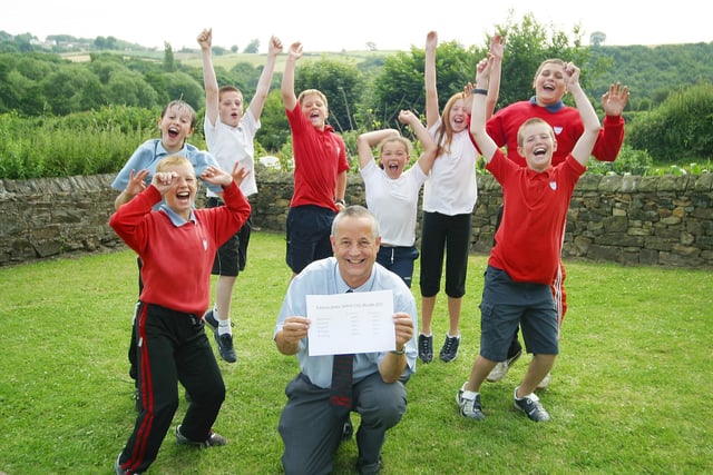 Unstone junior school pupils celebrate their SATS results in 2003.