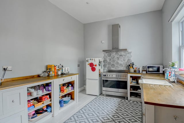 The spacious kitchen has oak base units and solid wood work surfaces. There is space for a range cooker with extractor hood and room for a fridge/freezer and a washing machine.