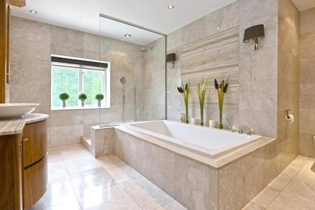 An incredible sight. The family bathroom features this stunning bath and shower, with plenty of storage as well for make-up, deodorants or any other toiletries.