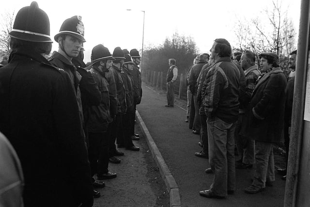 Miners picket face police at Bolsover Colliery, in April 1984