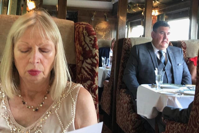 What’s for dinner … passengers study the menu aboard the Northern Belle
