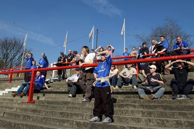 Town fans soak up the spring sunshine at Griffin Park.