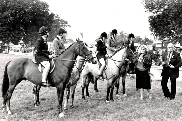 Winners of the junior fox hunter class presented with rosettes at Ashover Show, 1985.
