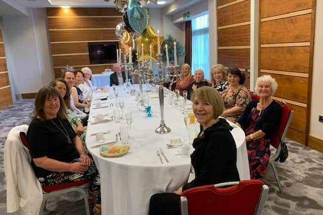 Glynnis Keir, daughter of Gladys Warrington (front) with Gladys, fourth right, and birthday party guests at the Casa Hotel, Chesterfield.