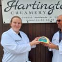Adrian Fowler handing over his family's pride and joy to Hartington Creamer's head cheesemaker Diana Alcock. (Photo: Contributed)