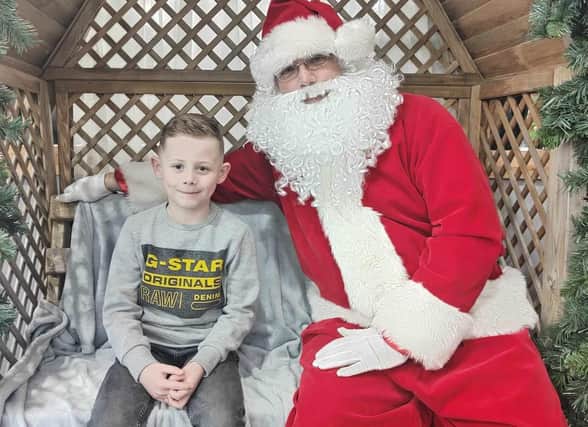 Jack Parker meeting Santa at Dobbies garden centre last year.