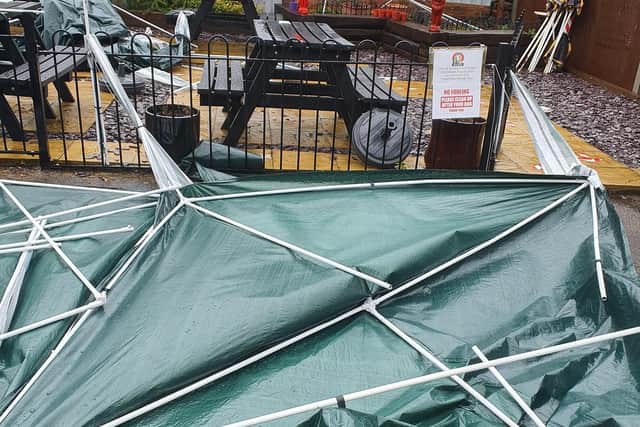 The collapsed gazebos.