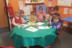 The children at Tideswell Preschool painting daffodils and celebrating their good Ofsted rating. Photo Tideswell Preschool