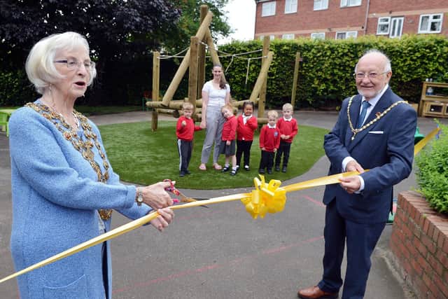 Henry Bradley Infant School's new playground area has been officially opened by the Mayor of Chesterfield Coun Glenys Falconer and consort Keith Falconer, seen cutting the ribbon for the Nursery play area
