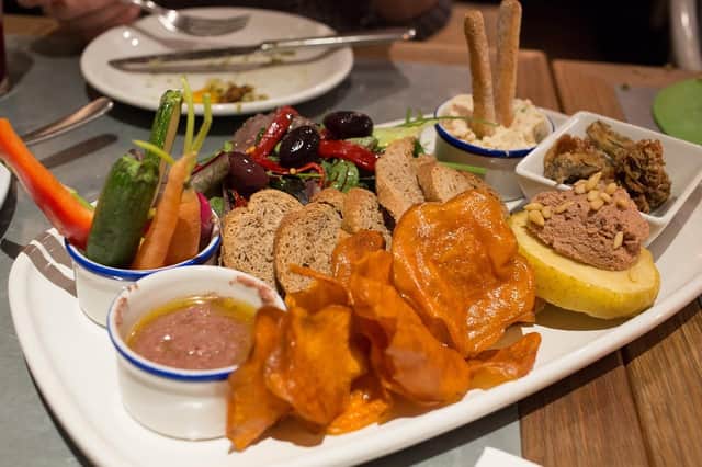 Tapas originates from Spanish cuisine, but can involve foods from various cultures and countries.