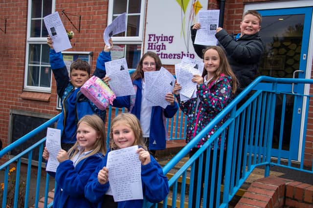Pupils at Kirkstead Junior Academy in Pinxton showing off their news articles