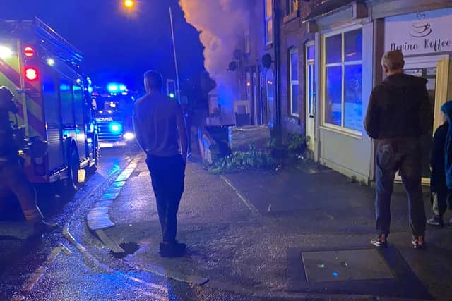 A cannabis grow was uncovered at a house next door to where the fire took place.