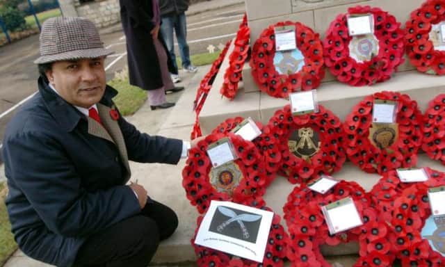 Surjit Duhre laying a wreath on the behalf of the Black Minorities Community Group, 2006.