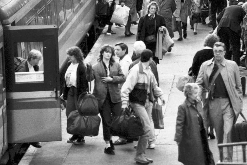 Passengers getting off a 'slam door' diesel train at a platform on Edinburgh's Waverley station in October 1988.
