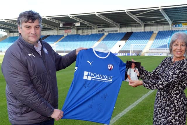 John Croot, Chesterfield FC chief executive, presenting the signed Spireites' shirt to Julie Banks, the daughter of Brian Debell. Picture by Brian Eyre.