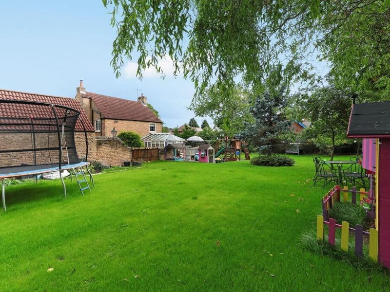The lawned garden has plenty of play space for children.