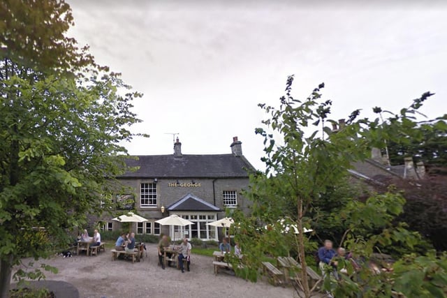 The George is listed in the Michelin Guide, which says that “charm and character ooze from this former pub, which overlooks the green of a sleepy Peak District village.”