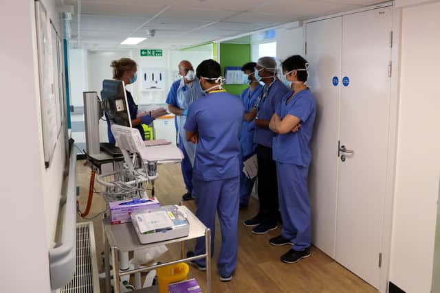 Hospital staff on a Covid-19 recovery ward. (Photo by Steve Parsons - Pool/Getty Images)