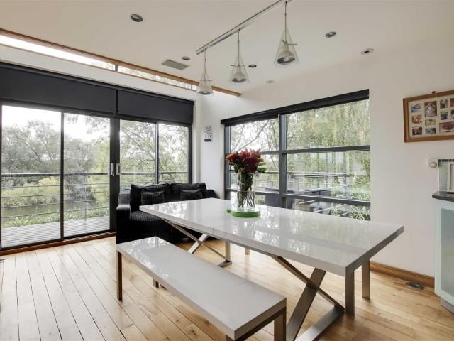The dining area has wood flooring.